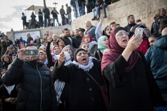 Palestinians in East Jerusalem protest President Donald Trump's announcement about recognizing Jerusalem as the capital of Israel, Damascus Gate, Jerusalem, December 7, 2017. (Hadas Parush/Flash90)