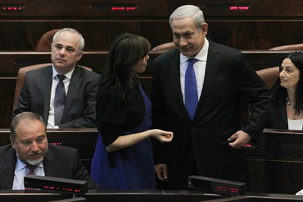 Israel's Prime Minister Benjamin Netanyahu seen speaking with fellow Likud parliament member Tzipi Hotovely during a plenum session in the Israeli parliament on October 15, 2012. (Miriam Alster/Flash90)