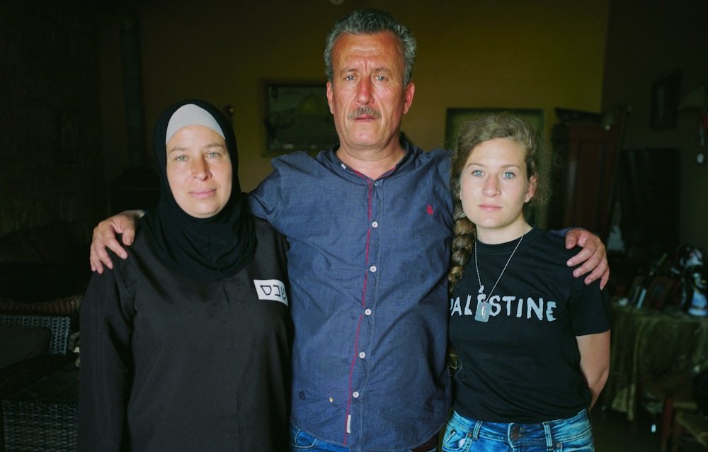 Nariman Tamimi (left), Bassem Tamimi (center), and Ahed Tamimi seen in their home in Nabi Saleh, February 2017. (Oren Ziv/Activestills.org)