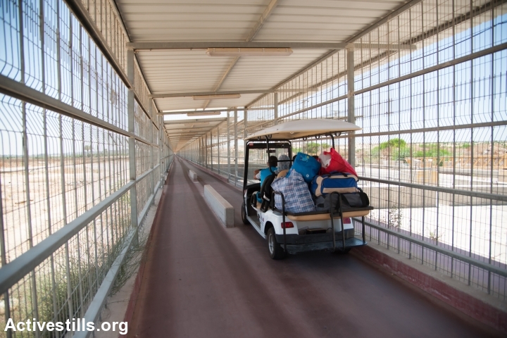 An electric cart provides transportation through the 900-meter caged terminal spanning the restricted access zone at the Erez border crossing between Israel and the Gaza Strip, July 2, 2012. (Ryan Rodrick Beiler)