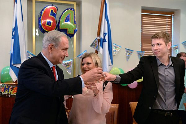 Israeli Prime Minister Benjamin Netanyahu seen with his wife Sara and their son Yair, celebrating the Prime Minister's 64th birthday, October 20, 2013. (Kobi Gideon/GPO