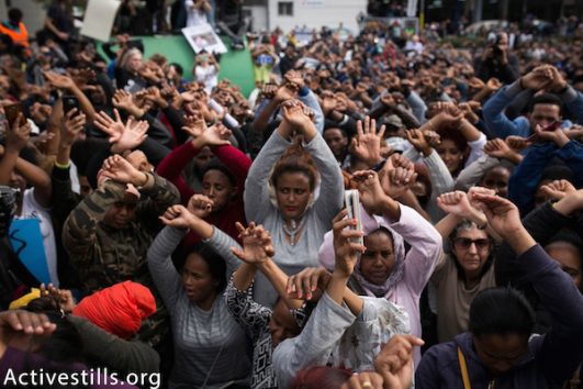Thousands of activists and asylum seekers protest outside the Rwandan embassy in Herzliya. February 7, 2018. (Shiraz Grinbaum/Activestills.org)