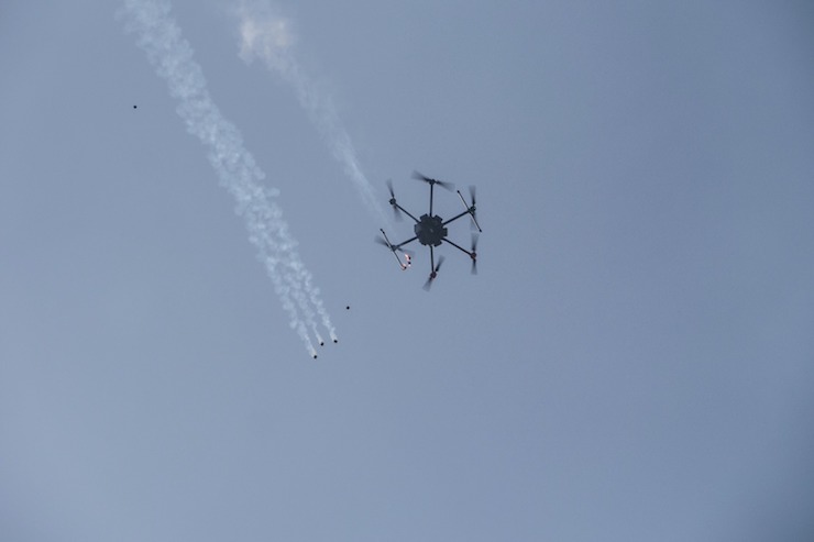 An Israeli army drone drops tear gas canisters onto Palestinians gathered at the Great March of Return, east of Shujaiyeh, March 30, 2018. (+972 Magazine)