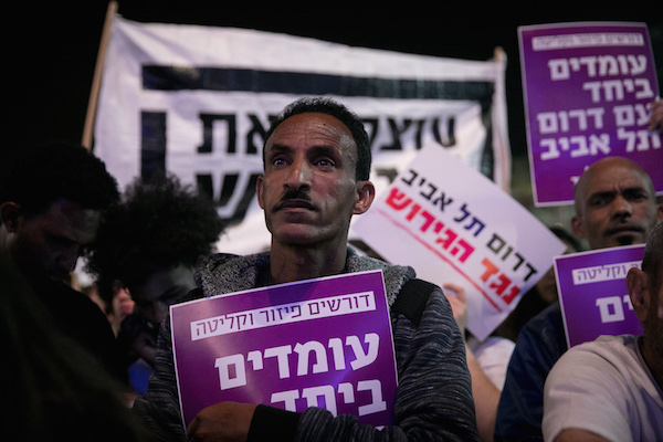 African asylum seekers and human rights activists protest against deportation of asylum seekers at Rabin Square in Tel Aviv on March 24, 2018.  (Alster/Flash90)