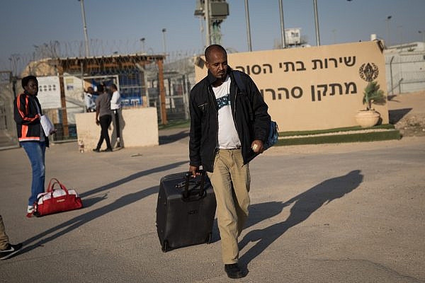 An african asylum seeker who had been detained at the Saharonim prison for refusing to be reported, leaves prison after the High Court ruled there was no legal justification to keep them in detention. April 15, 2018. (Hadas Parush/FLASH90)