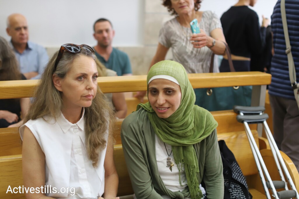 Palestinian poet Dareen Tatour (right) seen with her attorney, Gaby Lasky, at the Nazareth Magistrate's Court on May 3, 2018. Tatour was convicted of incitement and support for terrorism after publishing a number of poems on Facebook in 2015. (Oren Ziv/Activestills.org)