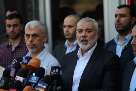 Hamas Chief Ismail Haniyeh speaks to the press upon his arrival at the Rafah border crossing, after reconciliation talks in Egypt with the Fatah movement mediated by Egyptian intelligence, in the southern Gaza Strip, September 19, 2017. (Abed Rahim Khatib/ Flash90)
