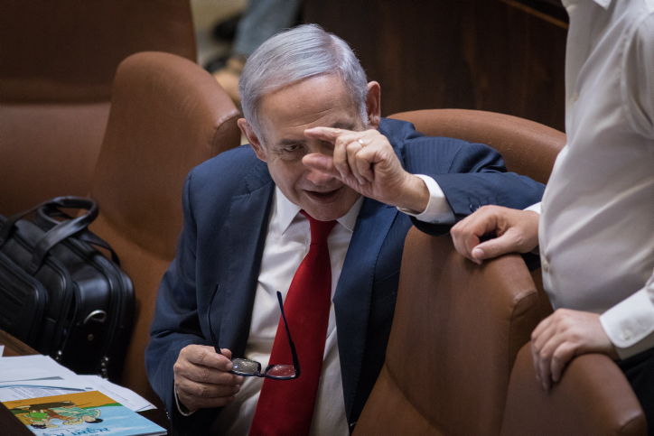 Prime Minister Benjamin Netanyahu seen in the Knesset plenum ahead of the vote on the Jewish Nation-State Law, July 18, 2018. (Hadas Parush/Flash90)