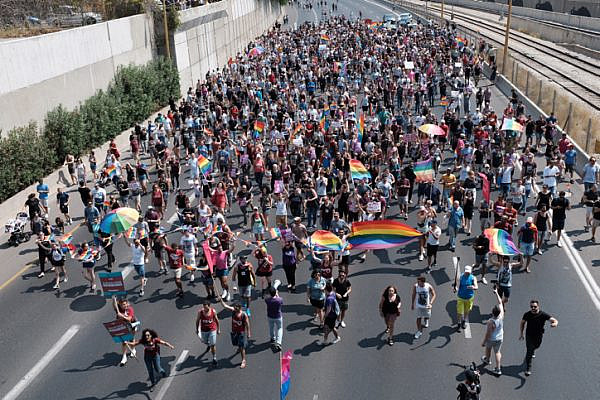 Members of the LGBTQ community and supporters block Ayalon Highway to protest a Knesset bill denying surrogacy for same-sex couples, Tel Aviv on July 22, 2018. (Tomer Neuberg/Flash90)