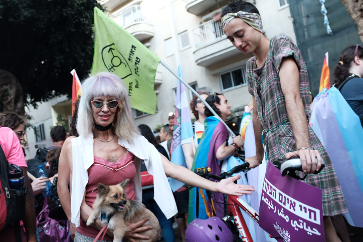 Members of the LGBTQ community demonstrate following the stabbing a transgender sex worker in Tel Aviv, July 22, 2018. (Tomer Neuberg/Flash90)