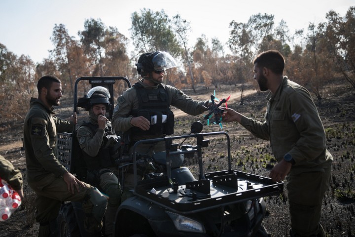 Israeli Border Police dismantle a Palestinian kite they took down with a drone in a field near the border with the Gaza Strip, May 15, 2018. (Hadas Parush/Flash90)
