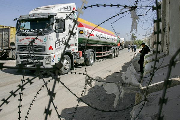 A truck is seen at the Israeli army controlled Kerem Shalom crossing, the only commercial crossing where goods can enter and exit Gaza, March 22, 2018. (Abed Rahim Khatib/Flash90)