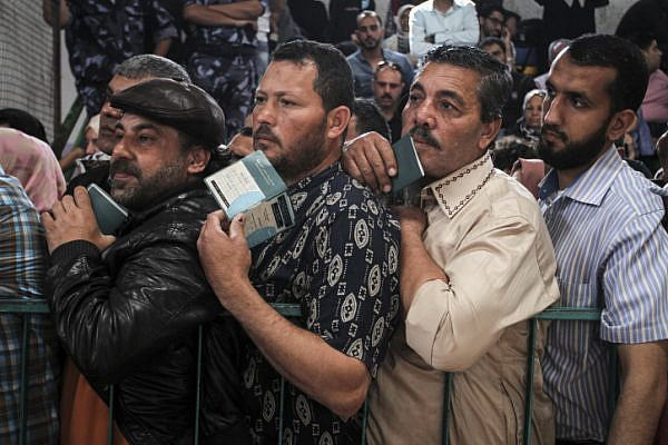 Palestinians wait at the Rafah border crossing with Egypt, in the southern Gaza Strip, after it was opened for two days by Egyptian authorities, May 11, 2016. (Abed Rahim Khatib/ Flash90)