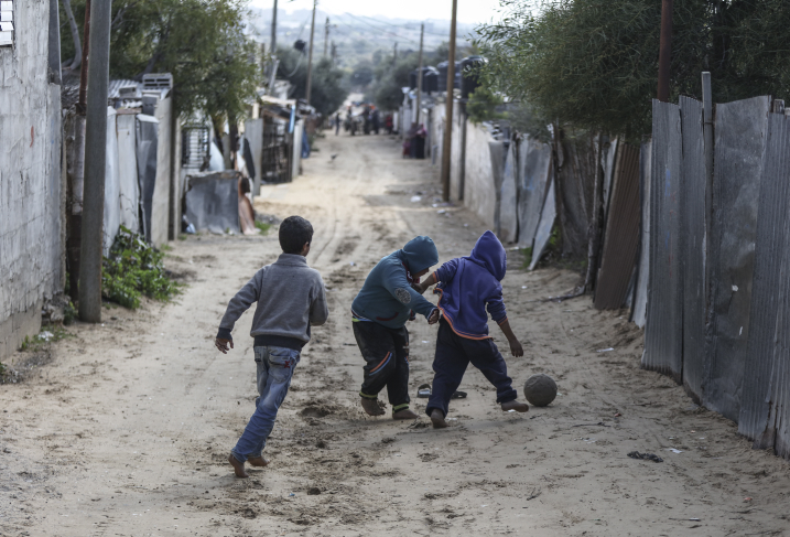 Palestinian refugees play in an impoverished area in Gaza City on January 17, 2018, after the White House froze tens of millions of dollars in aid to UNRWA. (Wissam Nassar/Flash90)