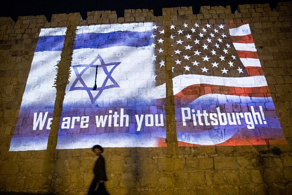 The Israeli and the American flags are screened on the walls of Jerusalem's Old City, on October 28, 2018, in solidarity with the victims who were killed in a mass shooting at Pittsburgh synagogue. (Yonatan Sindel/Flash90)