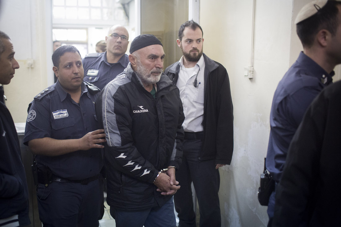 Anti-occupation activist Ezra Nawi is led into the Jerusalem Magistrate's Court days after being arrested, January 21, 2016. (Oren Ziv/Activestills.org)