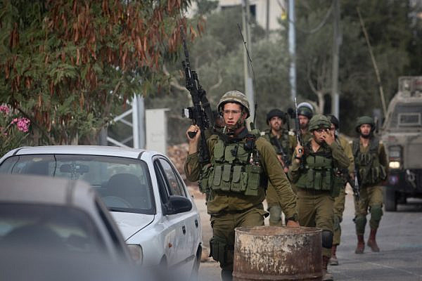 Israeli soldiers near the house of Baraa Ibrahim Sale after it was demolished by the Israeli army in the West Bank village of Deir Abu Mashal, near Ramallah, August 10, 2017. Baraa Ibrahim Sale carried out a terror attack with two other Palestinians, killing Border Police officer Hadas Malkam. (Flash90)