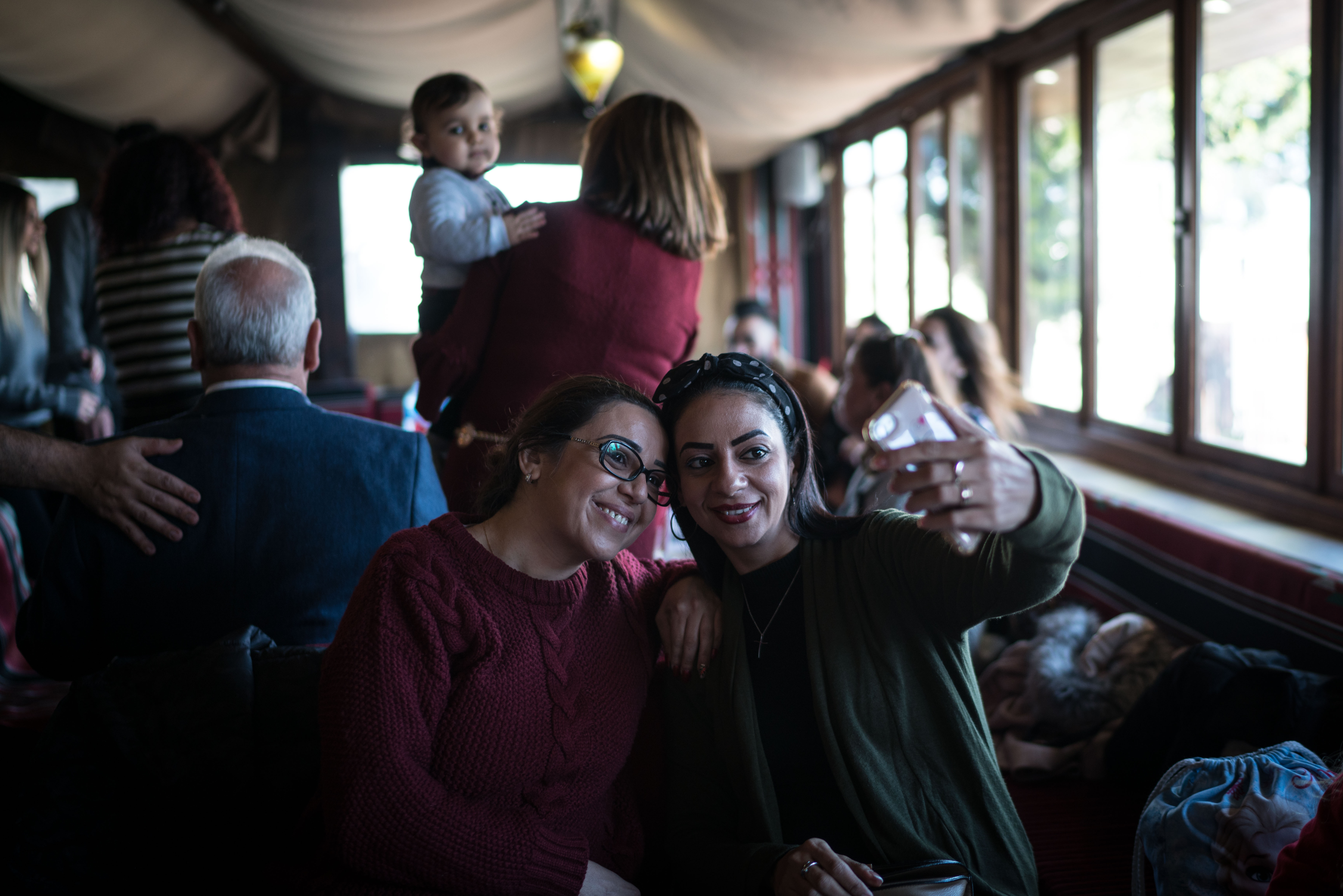 Nisreen Antone takes a selfie with her sister whom she hadn't seen for three years, during their Christmas lunch in Bethlehem on December 25, 2018.