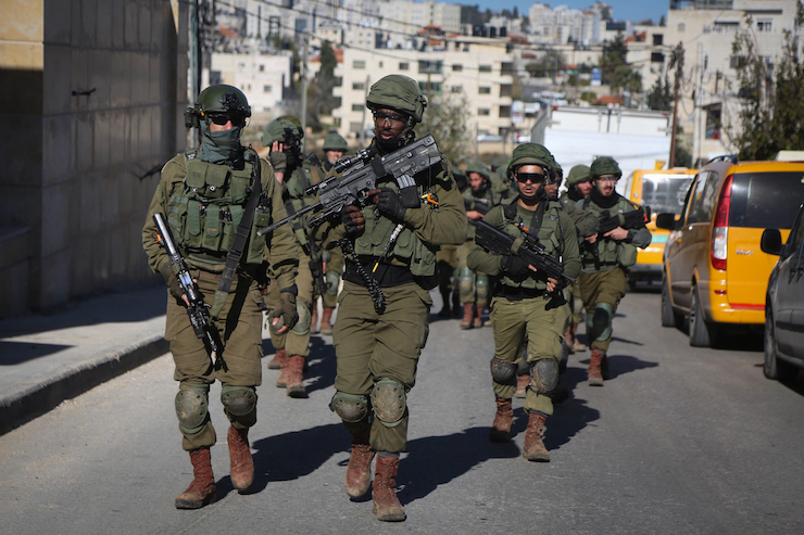 Israeli soldiers marching through the streets of Ramallah, occupied West Bank, December 15, 2018. (Flash90)
