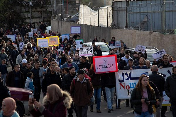 Israeli, international, and Palestinian activists march in the East Jerusalem neighborhood of Sheikh Jarrah against an expected new wave of demolitions, January 19, 2019. (Activestills.org)