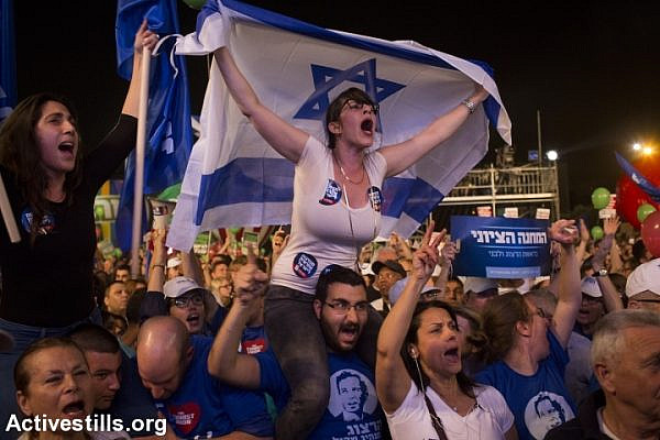 Israelis gather at a rally calling for a change of government and to replace Prime Minister Benjamin Netanyahu, at Rabin Square in Tel Aviv, March 7, 2015. (Oren Ziv/Activestills.org)