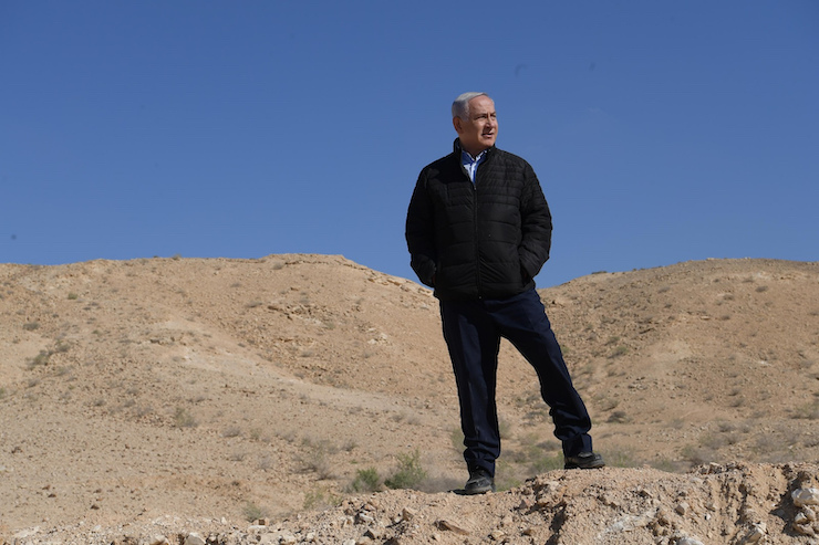 Israeli Prime Minister Benjamin Netanyahu in a government handout photo, taken near Israel's southern order with Egypt, March 7, 2019. (Amos Ben-Gershom/GPO/Handout)