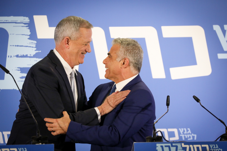 Benny Gantz and Yair Lapid of the Blue and White party give a joint statement in Tel Aviv on February 21, 2019. (Noam Revkin Fenton/Flash90)