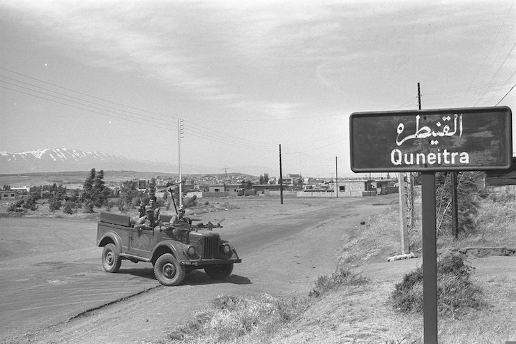 Israeli soldiers drive a captured Syrian army vehicle on the outskirts of the Golan city of Quneitra on June 11, 1967, a day after the war ended. (Moshe Milner/GPO)