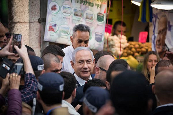 Israeli Prime Minister Benjamin Netanyahu seen during an election campaign tour in the Mahane Yehuda market in Jerusalem on April 8, 2019.  (Yonatan Sindel/Flash90)