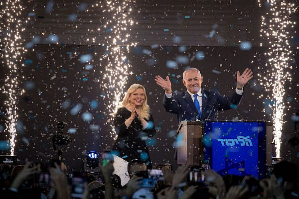 Prime Minister Benjamin Netanyahu and his wife Sara address their supporters as the results of the Israeli general elections are announced, at the party headquarters in Tel Aviv, on April 09, 2019. (Yonatan Sindel/Flash90)