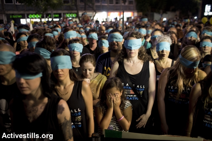 Israeli animal rights activists take part in a protest against animal cruelty, central Tel Aviv, August 24, 2013. (Oren Ziv/Activestills.org)
