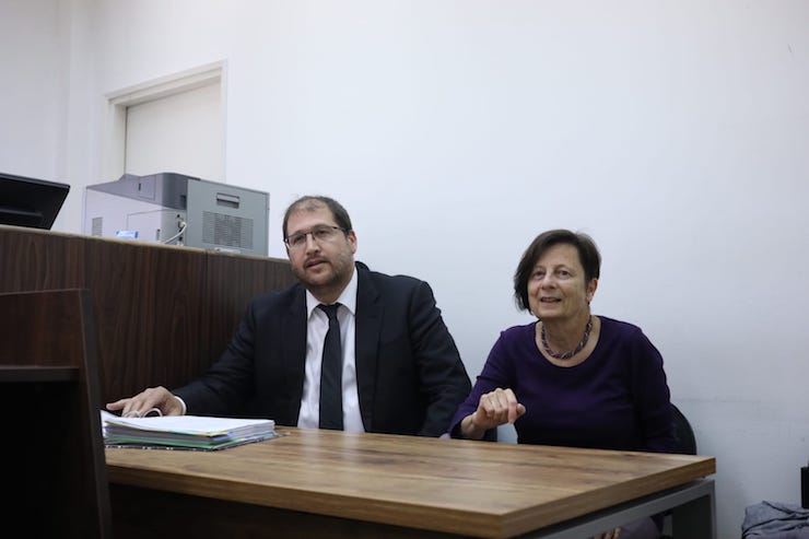 Left-wing activist Anat Matar (right) seen alongside attorney Michael Sfard in the Jerusalem Magistrate's Court, April 28, 2019. (Oren Ziv/Activestills.org)