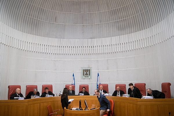 Supreme Court President Esther Hayut (C) and Judges of the Supreme Court arrive for a court hearing at the Supreme Court in Jerusalem, March 14, 2019. (Yonatan Sindel/Flash90)