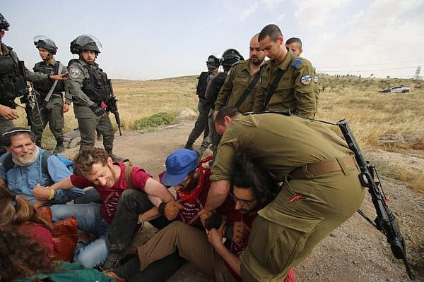 The Israeli army violently detained Palestinian, Israeli and international activists who were repairing an access road in the South Hebron Hills on May 3, 2019. (Ahmad al-Bazz/Activestills.org)