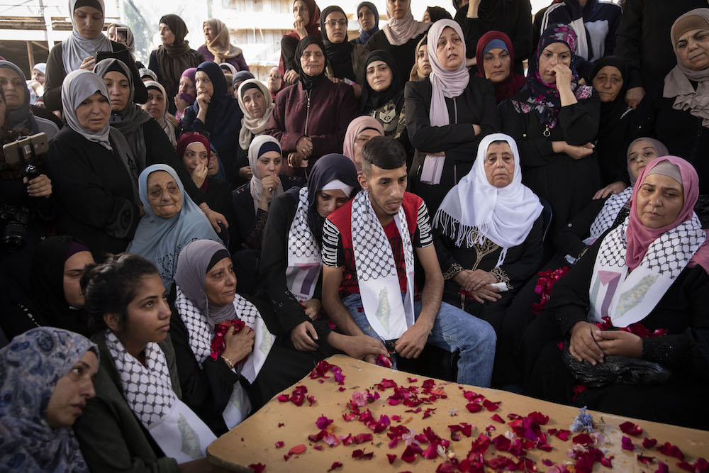 Family members mourn 20-year-old Mohammad Obeid after he was killed by police during clashes in the East Jerusalem neighborhood of Issawiya, July 1, 2019. (Oren Ziv/Activestills.org)