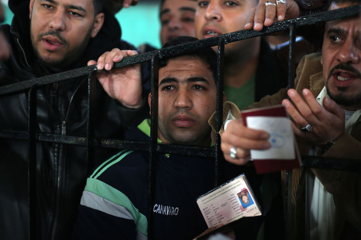 Palestinians wait at the Rafah border crossing with Egypt, in the southern Gaza Strip. (Mohammed Zaanoun)