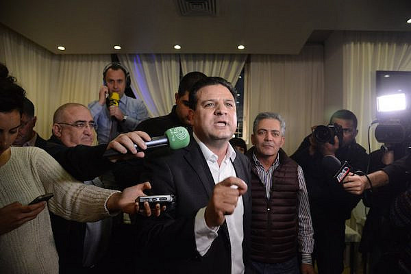 Ayman Odeh, head of the Joint List party, speaks to supporters at the party headquarters in Nazareth as the exit polls in the Israeli general elections for the 20th parliament are announced on March 17, 2015.  (Basel Awidat/Flash90)