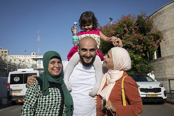 The family of East Jerusalem resident Mustafa al-Haruf greets him upon his release from Givon prison after nine months of detention, on October 24, 2019. (Oren Ziv/Activestills.org)