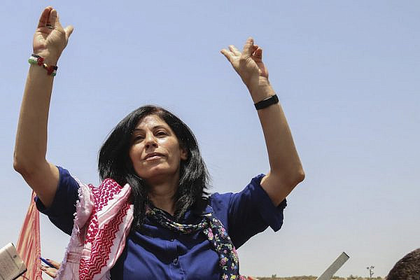 Palestinian lawmaker Khalida Jarrar of the Popular Front for the Liberation of Palestine (PFLP) upon her release from an Israeli prison, at a checkpoint near the West Bank town of Tulkarem, June 3, 2016. (Haytham Shtayeh/Flash90)