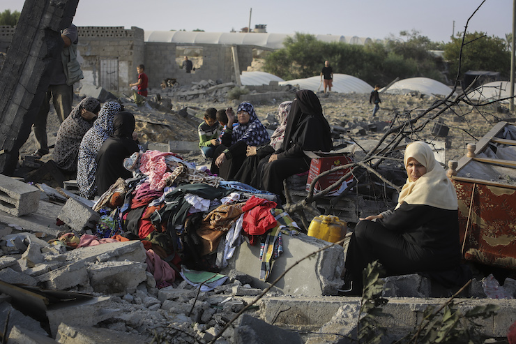 Palestinians gather around the remains of a house destroyed in an Israeli air strike in Rafah in the southern Gaza Strip, November 13, 2019. (Abed Rahim Khatib/Flash90)
