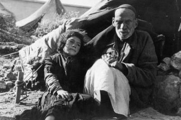 A Palestinian man and a girl in a refugee camp, 1948 (Photo via Wikimedia, license CC)