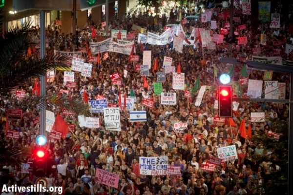 Israelis protesting in Tel Aviv in demand social justice, summer 2011. (Oren Ziv/Activestills)