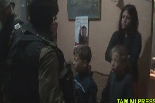Soldiers facing children in Nabi Saleh house (from a video by Bilal Tamimi)