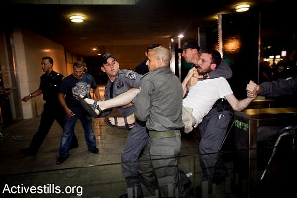 J14 protester arrested, June 23 2012. At least 89 people were detained or arrested in Tel Aviv (photo: Activestills.org)