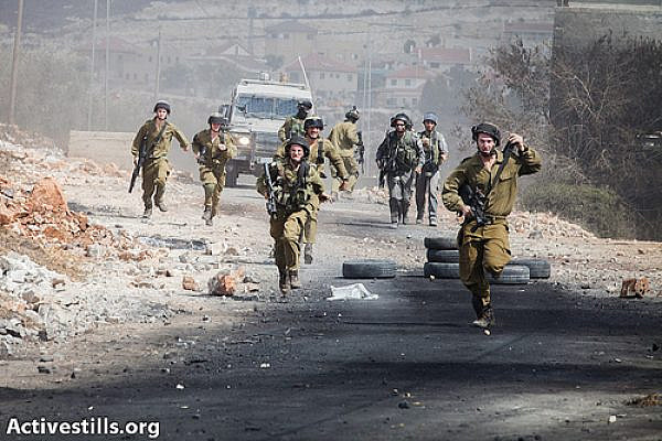 Israeli soldiers raid the west bank village of Kfer Qaddum during the weekly demonstration against the occupation, October 5, 2012. (photo: Yotam Ronen/ Activestills.org)