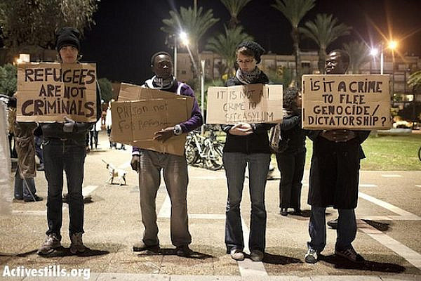 Activists protest in the center of Tel Aviv against the "infiltrators law", January 10, 2012 (Activestills)