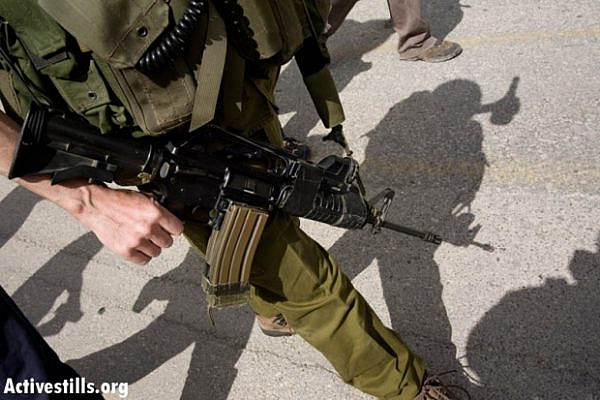 IDF soldier in Hebron (photo: Activestills.org)