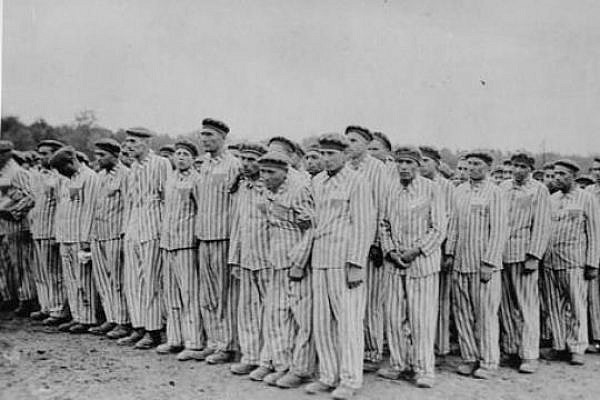 Prisoners standing during a roll call. Each wears a striped hat and uniform bearing colored, triangular badges and identification numbers. *''Buchenwald, [Thuringia] Germany, 1938-1941. [http://www.ushmm.org/ United States Holocaust Memorial Museum]
