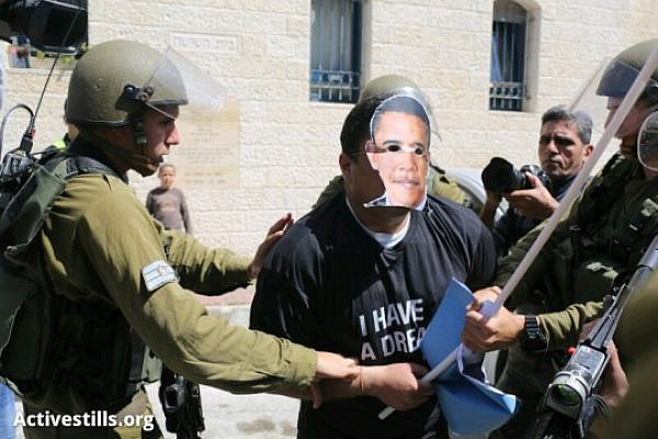 Non-violent Palestinian activist with Obama mask arrested in Hebron (Oren Ziv / Activestills)
