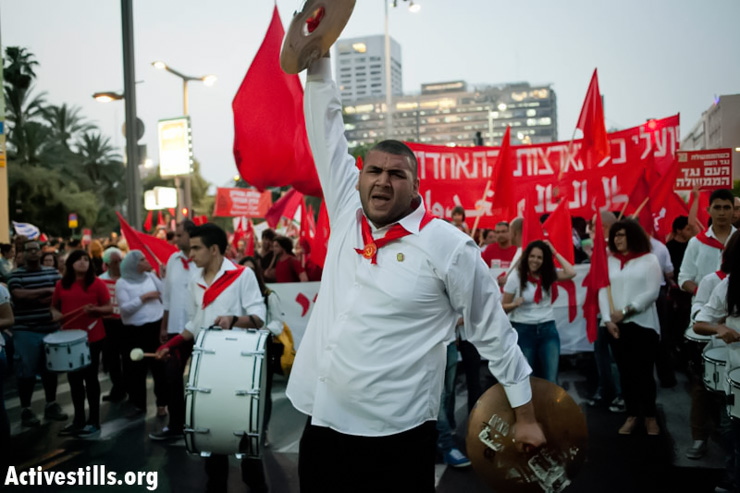 Demonstrators march during the International Worker's Day protest in the center of Tel Aviv May 1, 2013. (Photo by: Shiraz Grinbaum/ Activestills.org)